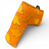The Dino Nugget Blade Putter Headcover features playful yellow chicken and dino nuggets on orange synthetic leather, plus a small black side tag. Magnetic closure and soft interior protect your putter.