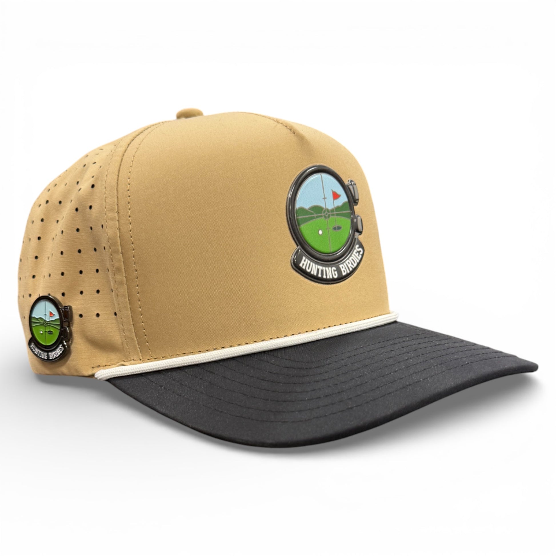 The Hunting Birdies Golf Hat is an adjustable tan and black snapback cap with a golf-themed logo, ventilation holes, contrast brim, and includes a built-in magnetic ball marker holder plus marker.