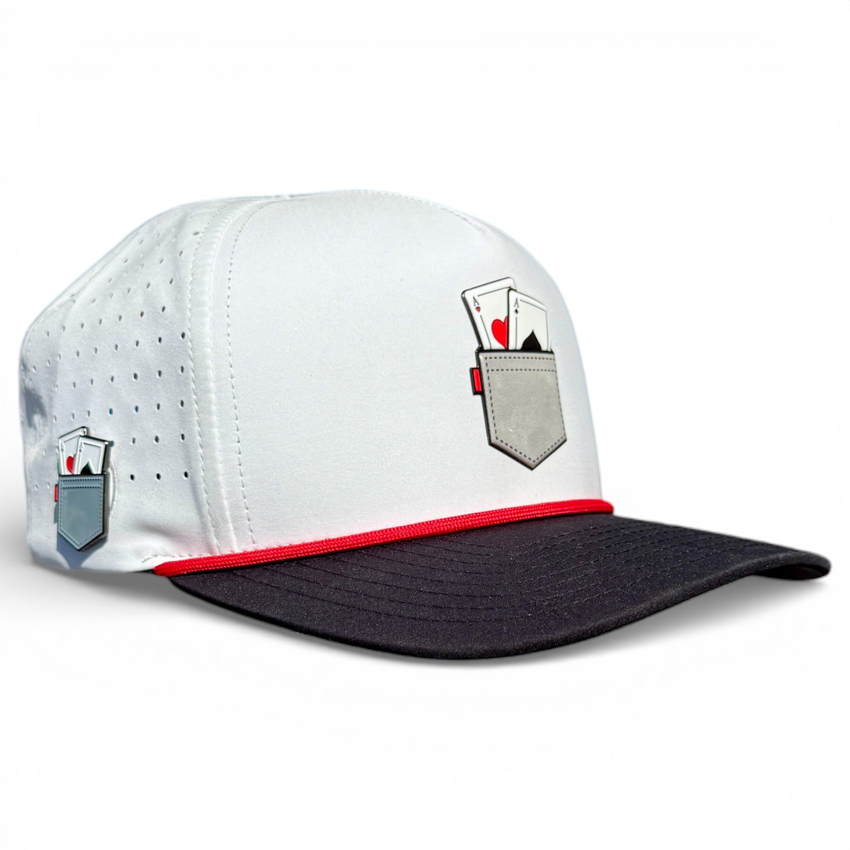 The Pocket Aces Golf Hat is an adjustable gray and black snapback cap featuring playing cards artwork on the front and side, plus a built-in magnetic ball marker holder with included marker for convenience.