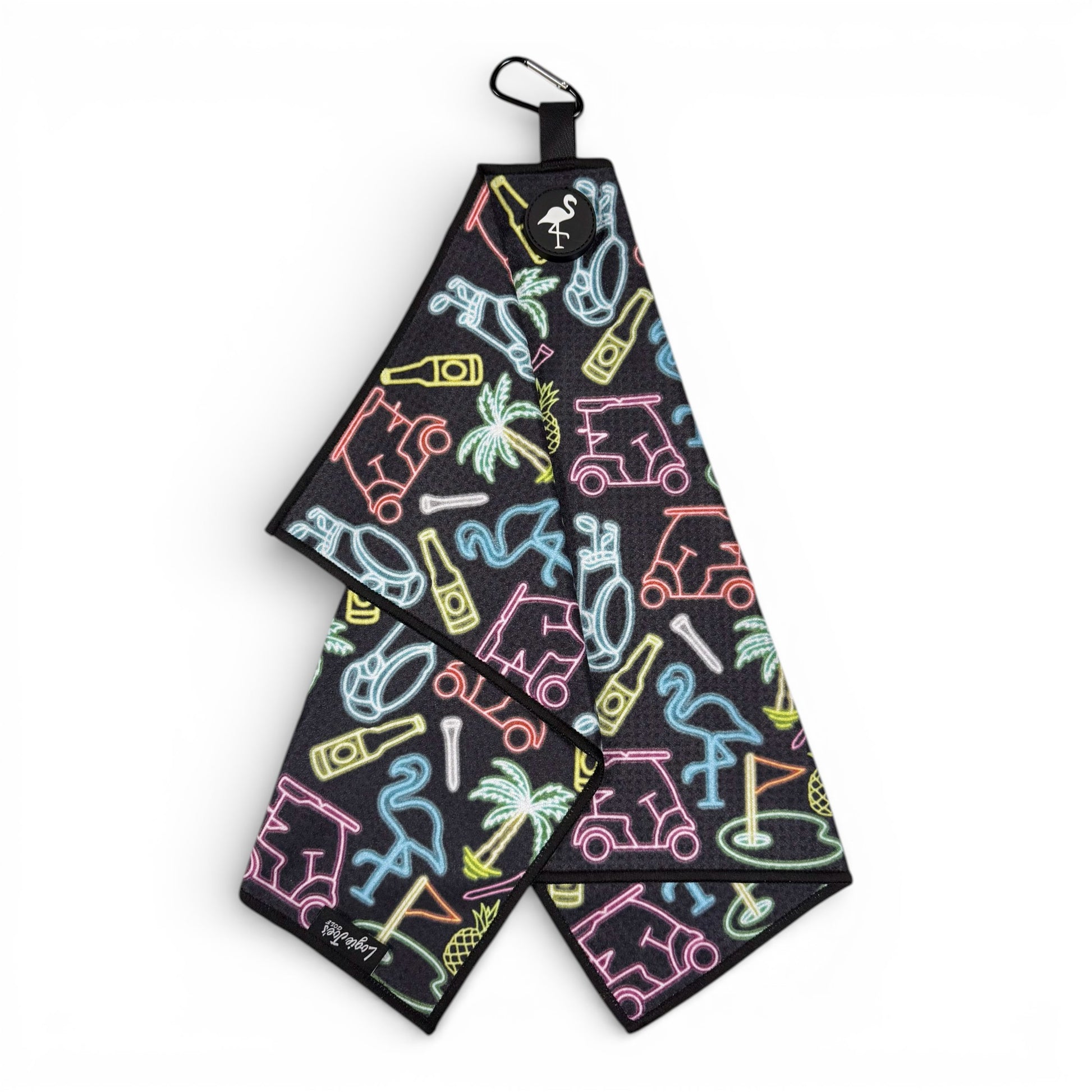 The Miami Slice Golf Towel is a black, double-sided microfiber towel (24x16 in) with neon-style golf carts, flamingos, and palms. It features a heavy-duty magnetic top, carabiner clip, and a premium waffle weave fabric.