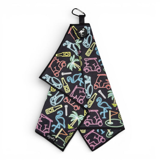 The Miami Slice Golf Towel is a black, double-sided microfiber towel (24x16 in) with neon-style golf carts, flamingos, and palms. It features a heavy-duty magnetic top, carabiner clip, and a premium waffle weave fabric.