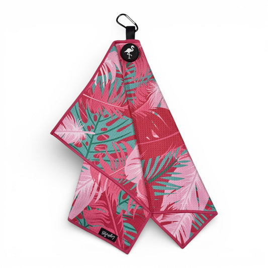 The Pink Tropical Golf Towel features premium double-sided microfiber, a heavy-duty magnetic design, and carabiner clip. Sized 24 x 16 in, it boasts a vibrant pink and green tropical leaf pattern with a flamingo icon.