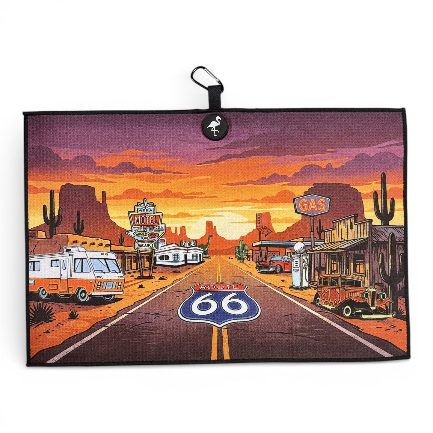 The Route 66 Golf Towel is a premium double-sided microfiber towel (24x16 in) with a magnetic holder and carabiner clip, featuring desert highway art with vintage cars—ideal for golfers seeking style and functionality.
