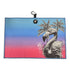 The Flamingo Palm Golf Towel features a blue and pink gradient with black and white flamingos and palm trees, a black loop, carabiner clip, magnetic circular patch with flamingo icon, and is made of premium double-sided microfiber (24 x 16 in).