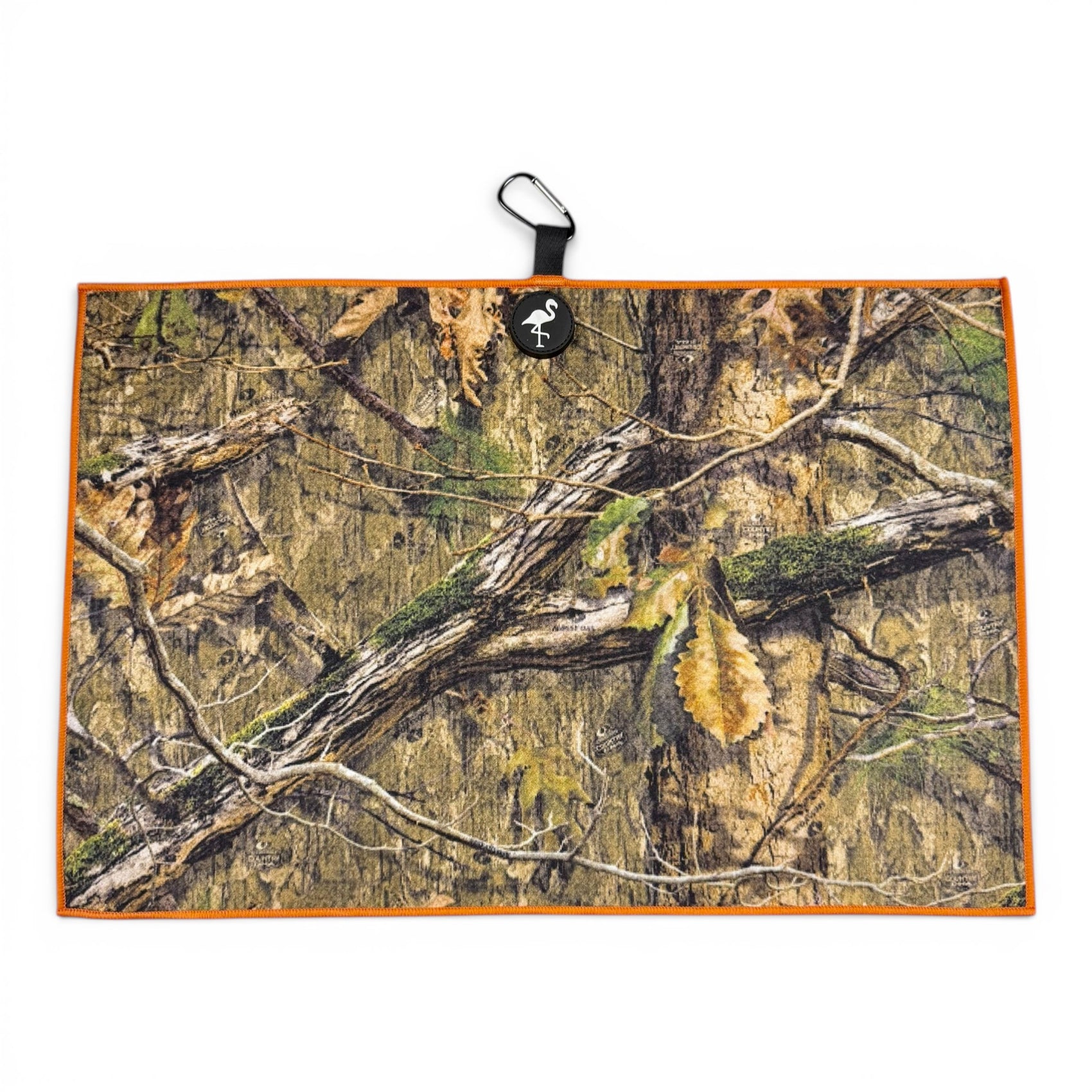 The Woodland Camo Golf Towel is a 24 x 16 in premium, double-sided microfiber towel with a forest camo print, orange border, black loop, carabiner clip, and built-in heavy-duty magnet for easy hanging.