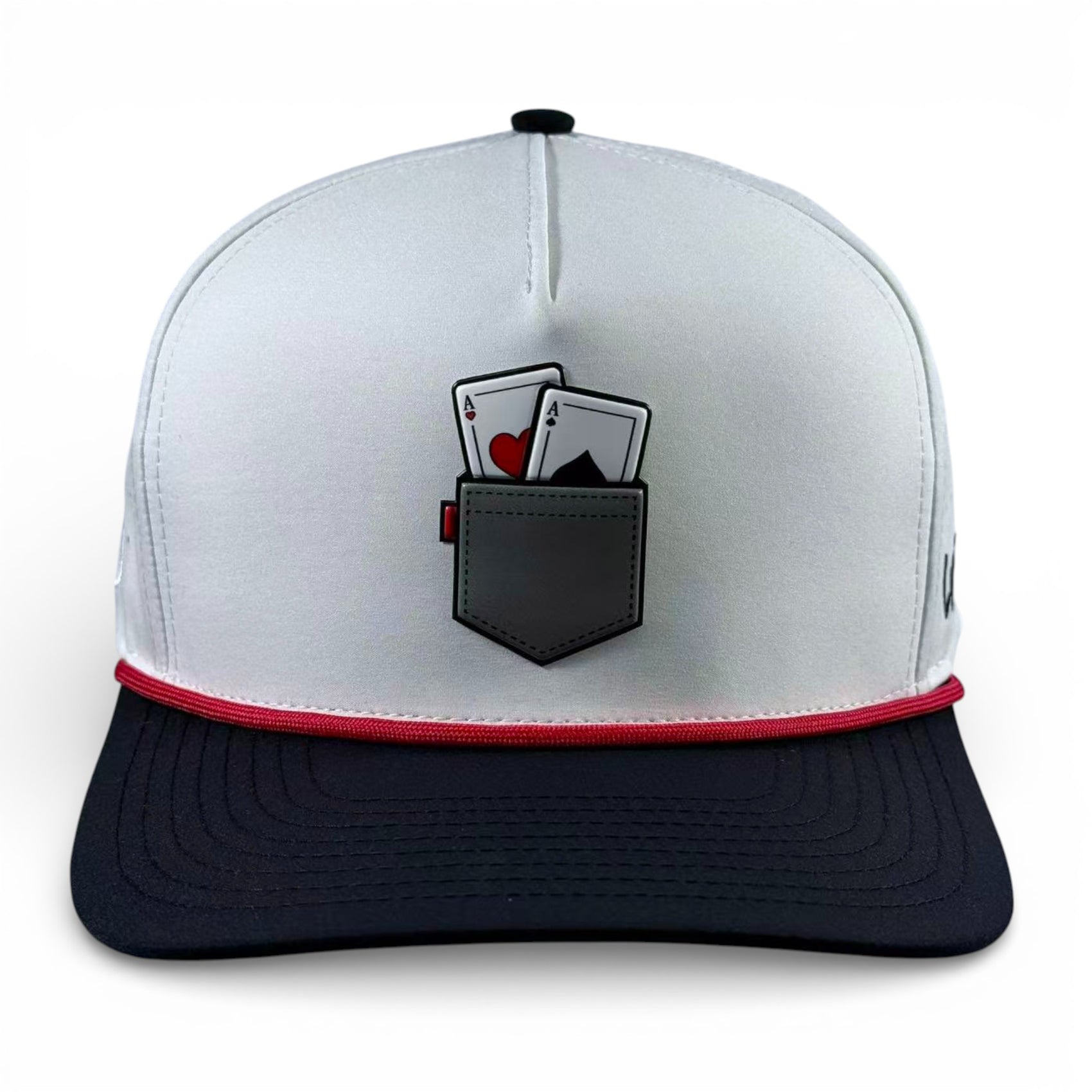 The Pocket Aces Golf Hat is an adjustable gray and black snapback cap featuring two playing cards (ace of hearts and spades) in a pocket design on the front, plus a built-in magnetic ball marker holder with marker included.