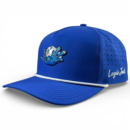 The Water Ball Golf Hat is a bright blue snapback cap with wave and surfboard graphics, Logie Joes white script, side vents, and an adjustable fit. It features a built-in magnetic ball marker holder with marker included for convenience.