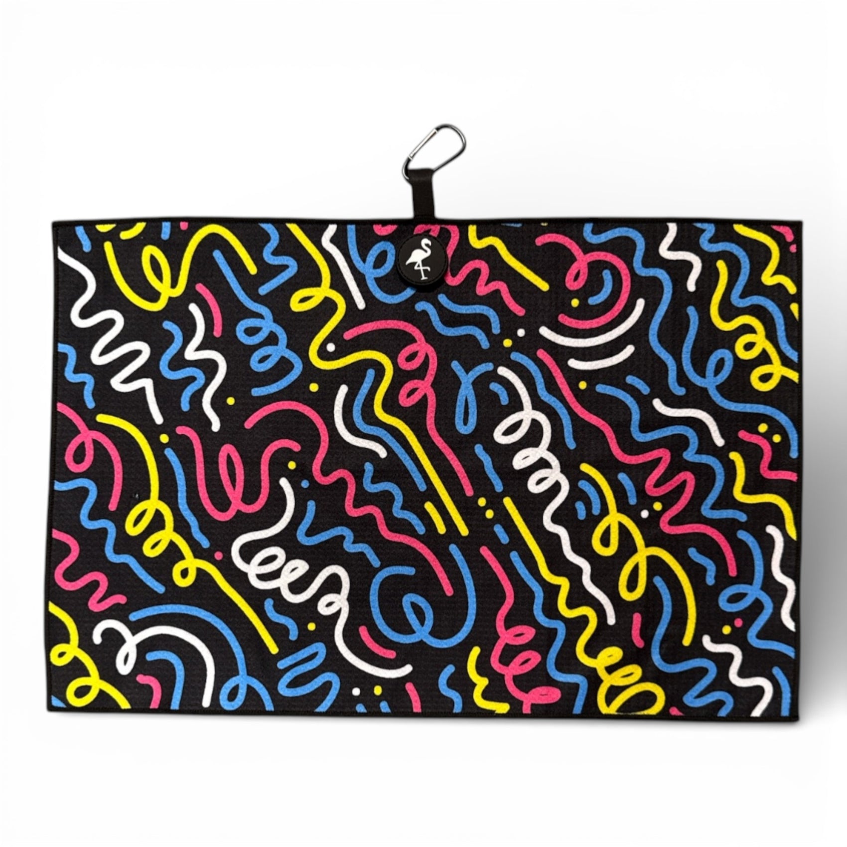 The Silly Straw Golf Towel is a 24 x 16 in black, double-sided microfiber towel with colorful wavy lines in blue, yellow, pink, and white. It features a heavy-duty magnetic design and comes with a carabiner clip for easy hanging.