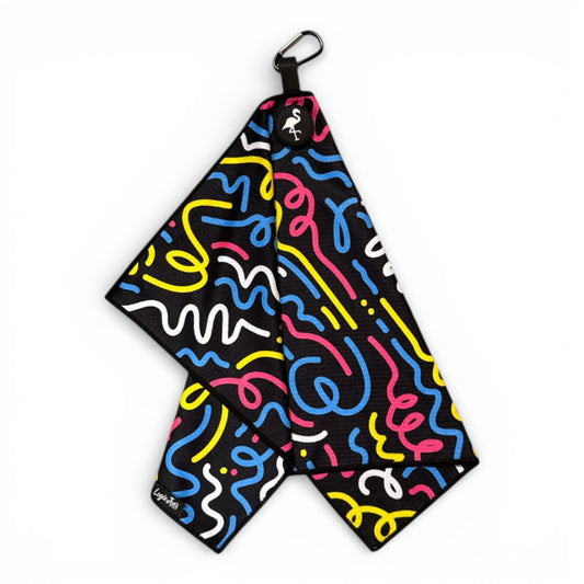 The Silly Straw Golf Towel is a 24 x 16 in black, double-sided microfiber towel with colorful squiggly lines, a heavy-duty magnetic center, and a carabiner clip—adding playful style and convenience to your golf gear.